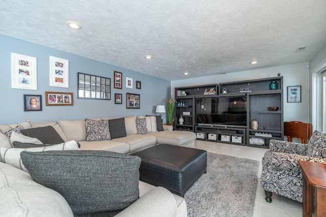 living room with a textured ceiling