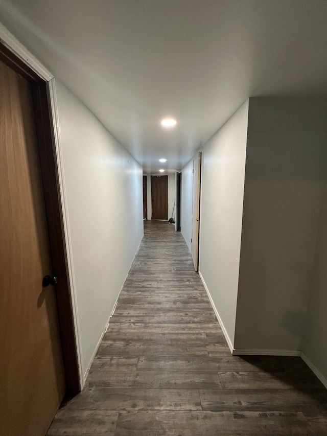 hallway featuring dark hardwood / wood-style floors