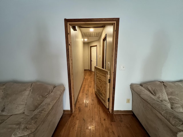 corridor with light hardwood / wood-style flooring