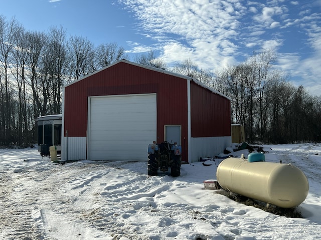 view of snow covered garage