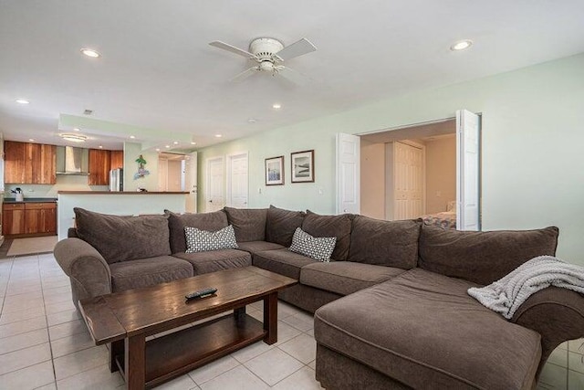 living room with ceiling fan and light tile patterned floors