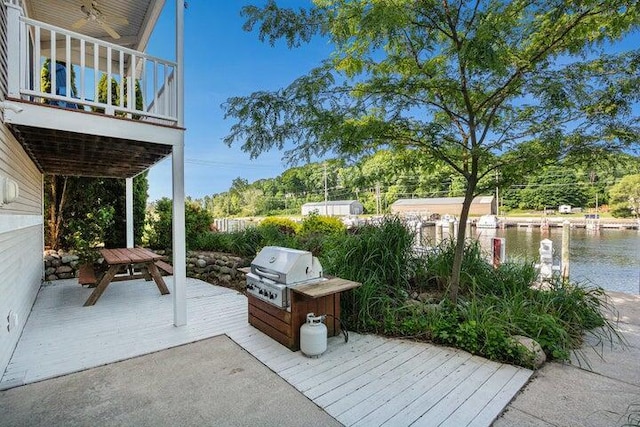 view of patio / terrace featuring a water view and area for grilling