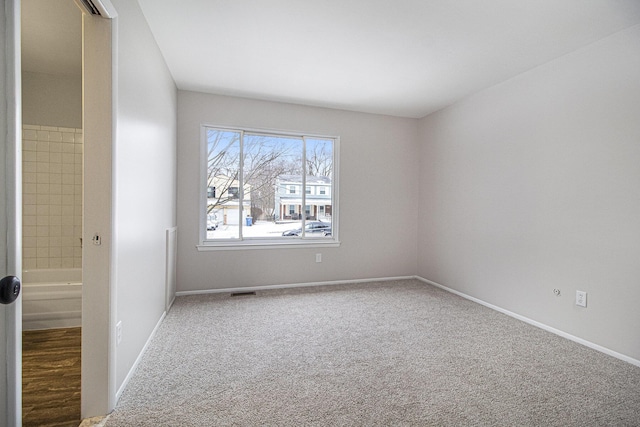 unfurnished room with carpet flooring