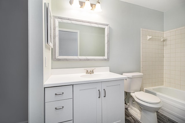 full bathroom with hardwood / wood-style flooring, vanity, toilet, and tiled shower / bath combo