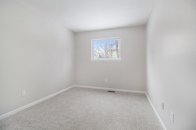 spare room featuring carpet flooring