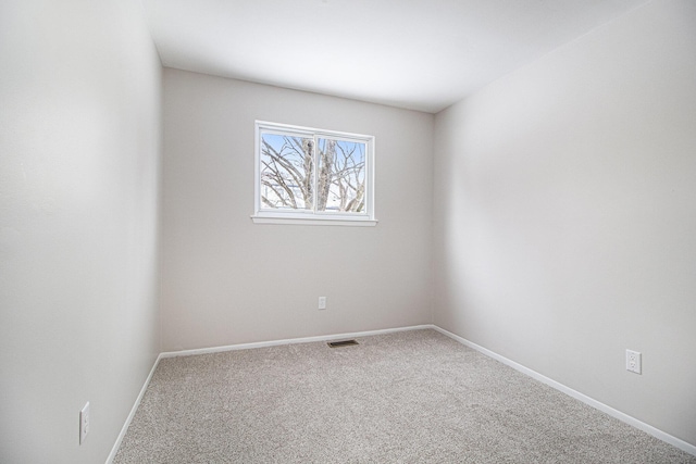 spare room featuring carpet