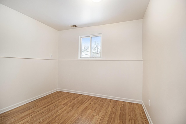 unfurnished room featuring wood-type flooring