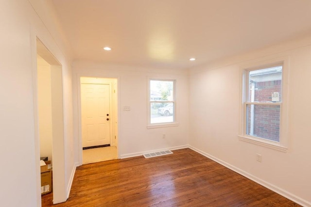 unfurnished room featuring hardwood / wood-style flooring