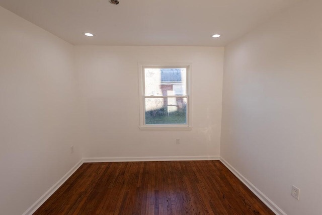 empty room with dark hardwood / wood-style floors