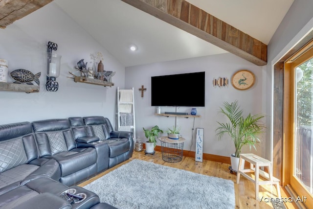 living room with hardwood / wood-style flooring and vaulted ceiling