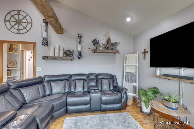 living room featuring vaulted ceiling and light hardwood / wood-style floors