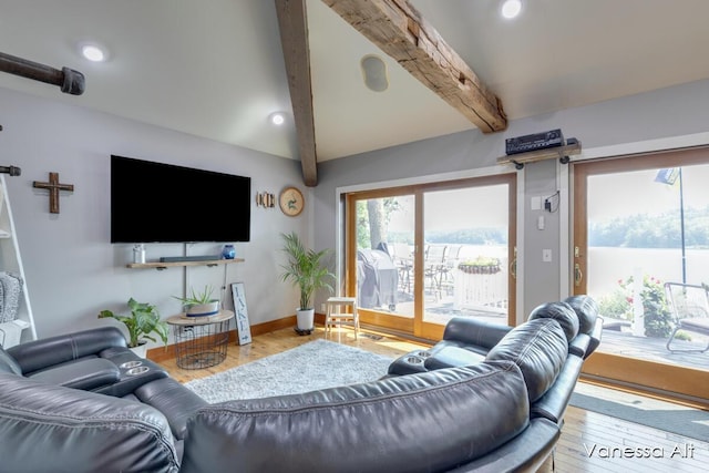 living room featuring wood-type flooring and beamed ceiling