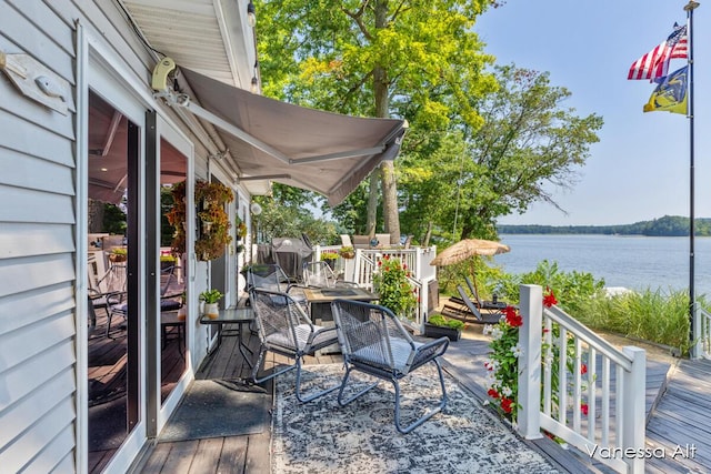 wooden terrace with a water view