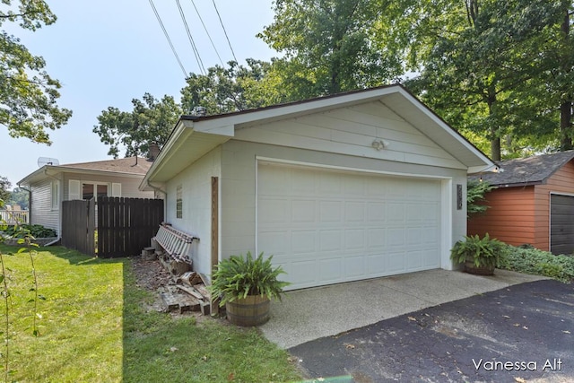 garage featuring a lawn