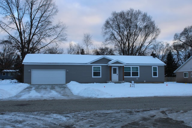 ranch-style house featuring a garage