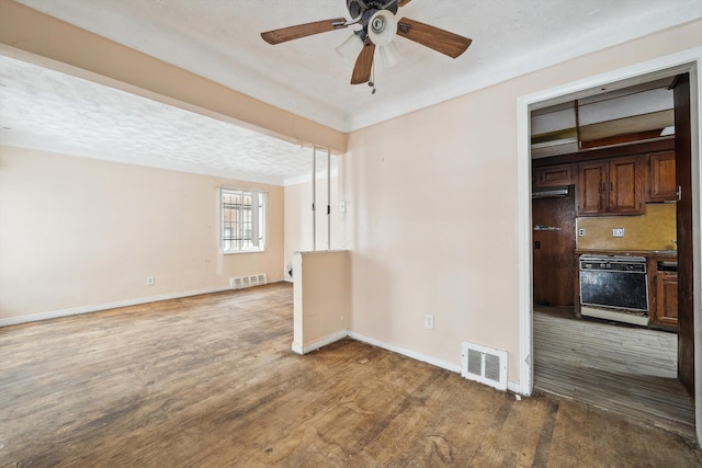 unfurnished room featuring ceiling fan, a textured ceiling, and hardwood / wood-style flooring