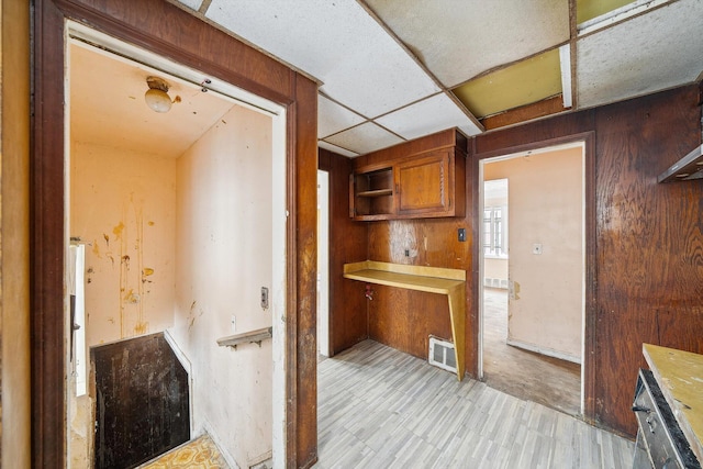 kitchen featuring a drop ceiling