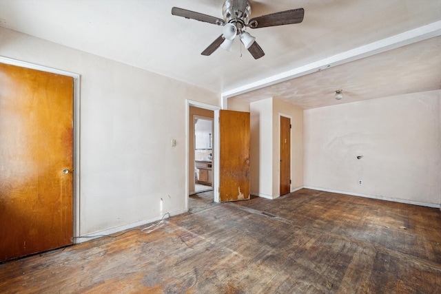 spare room featuring ceiling fan and dark hardwood / wood-style floors