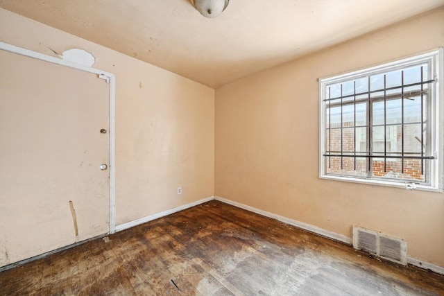 empty room featuring dark hardwood / wood-style floors