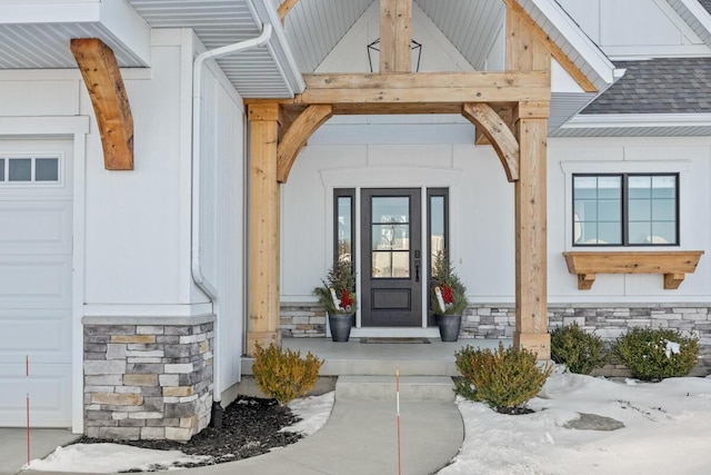 view of exterior entry with a garage