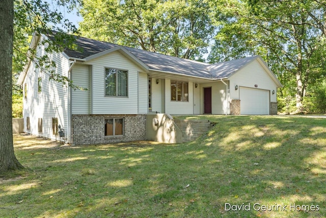 view of front of property with a front lawn and a garage