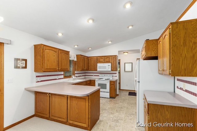 kitchen with kitchen peninsula, vaulted ceiling, sink, and white appliances