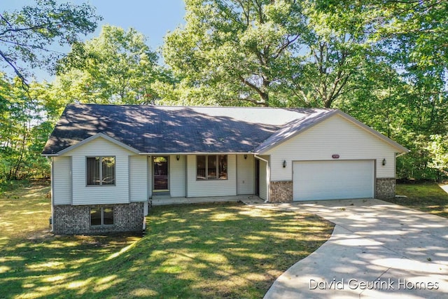 view of front of property featuring a garage and a front lawn