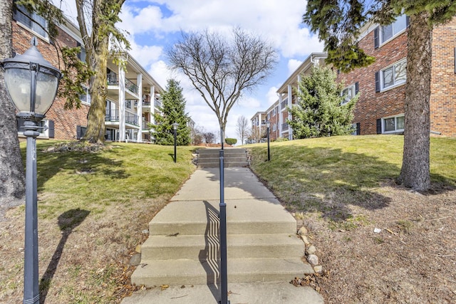 view of home's community featuring a yard