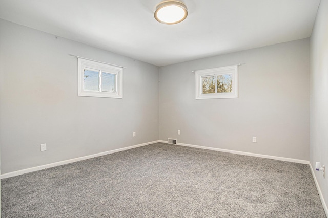 empty room featuring carpet floors