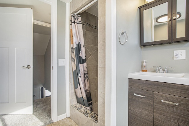 bathroom featuring vanity and walk in shower