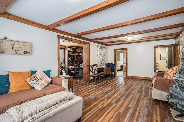 living room featuring dark hardwood / wood-style flooring, beam ceiling, and plenty of natural light