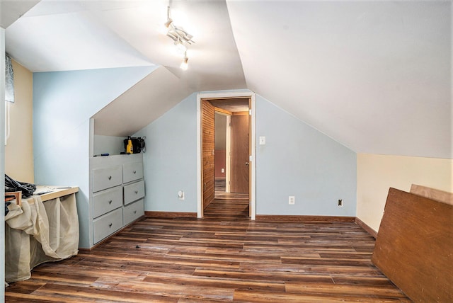 bonus room with lofted ceiling and dark hardwood / wood-style floors