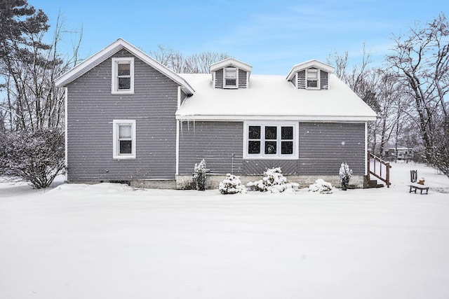 view of snow covered house