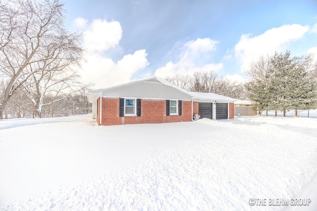 view of snow covered rear of property