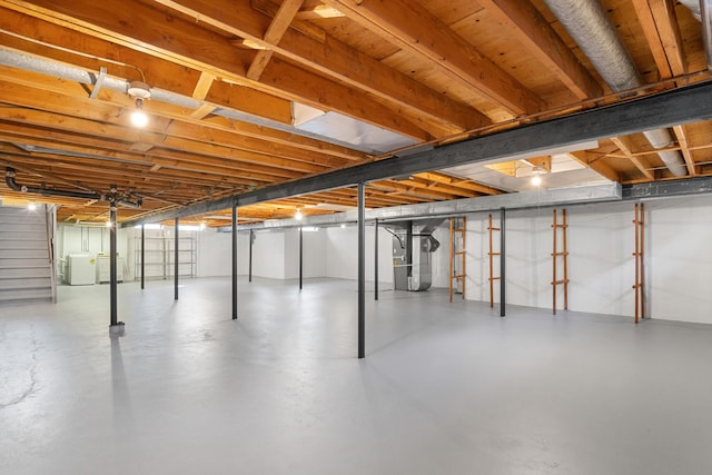 basement with washer and clothes dryer