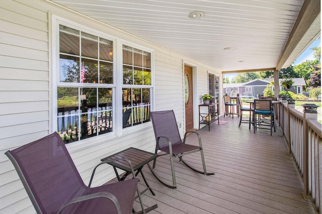 wooden terrace with a porch