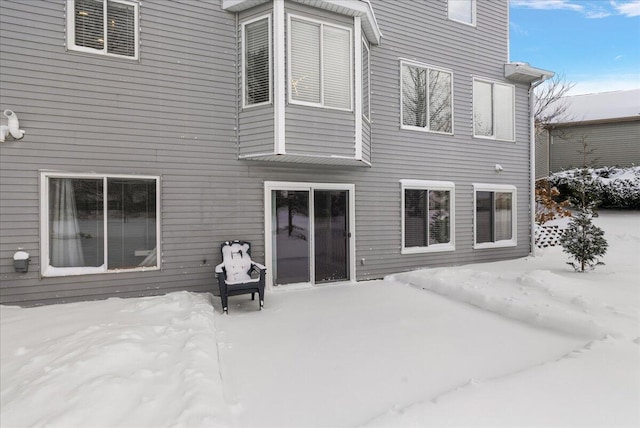 view of snow covered property