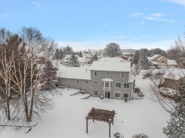 view of snow covered property