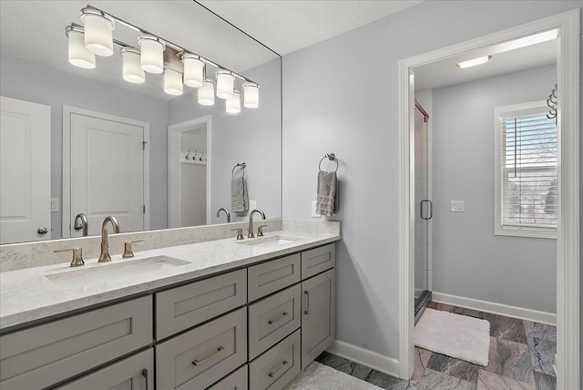 bathroom with walk in shower and vanity