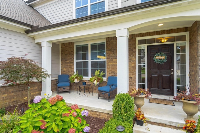 entrance to property featuring a porch