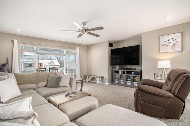 living room featuring ceiling fan and carpet floors