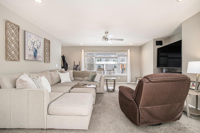 carpeted living room featuring ceiling fan