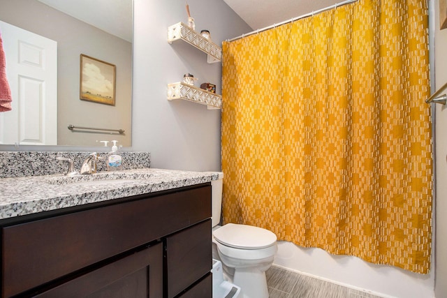 full bathroom featuring toilet, vanity, and shower / tub combo