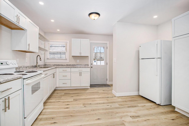 kitchen featuring white cabinetry, sink, white appliances, and light wood-type flooring