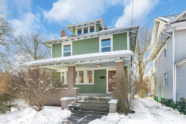 italianate home featuring covered porch