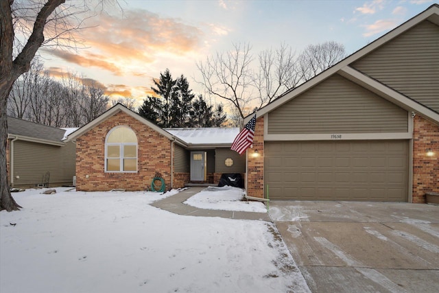 ranch-style house featuring a garage