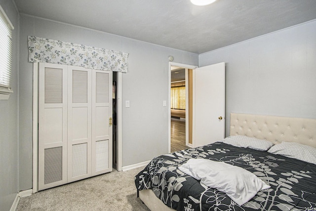 carpeted bedroom featuring a closet