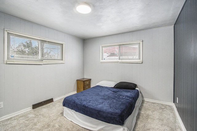 bedroom with light colored carpet