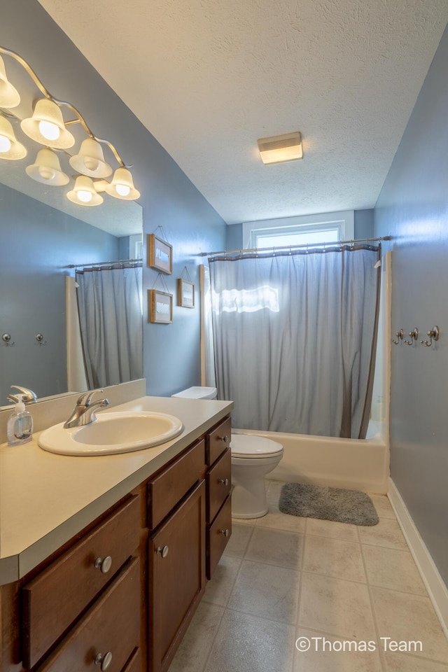 full bathroom with a textured ceiling, toilet, vanity, and shower / bath combo with shower curtain