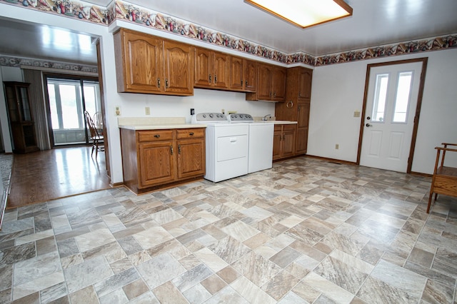 kitchen with washing machine and dryer